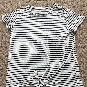 Girls navy blue/white striped T-shirt with not on the bottom.